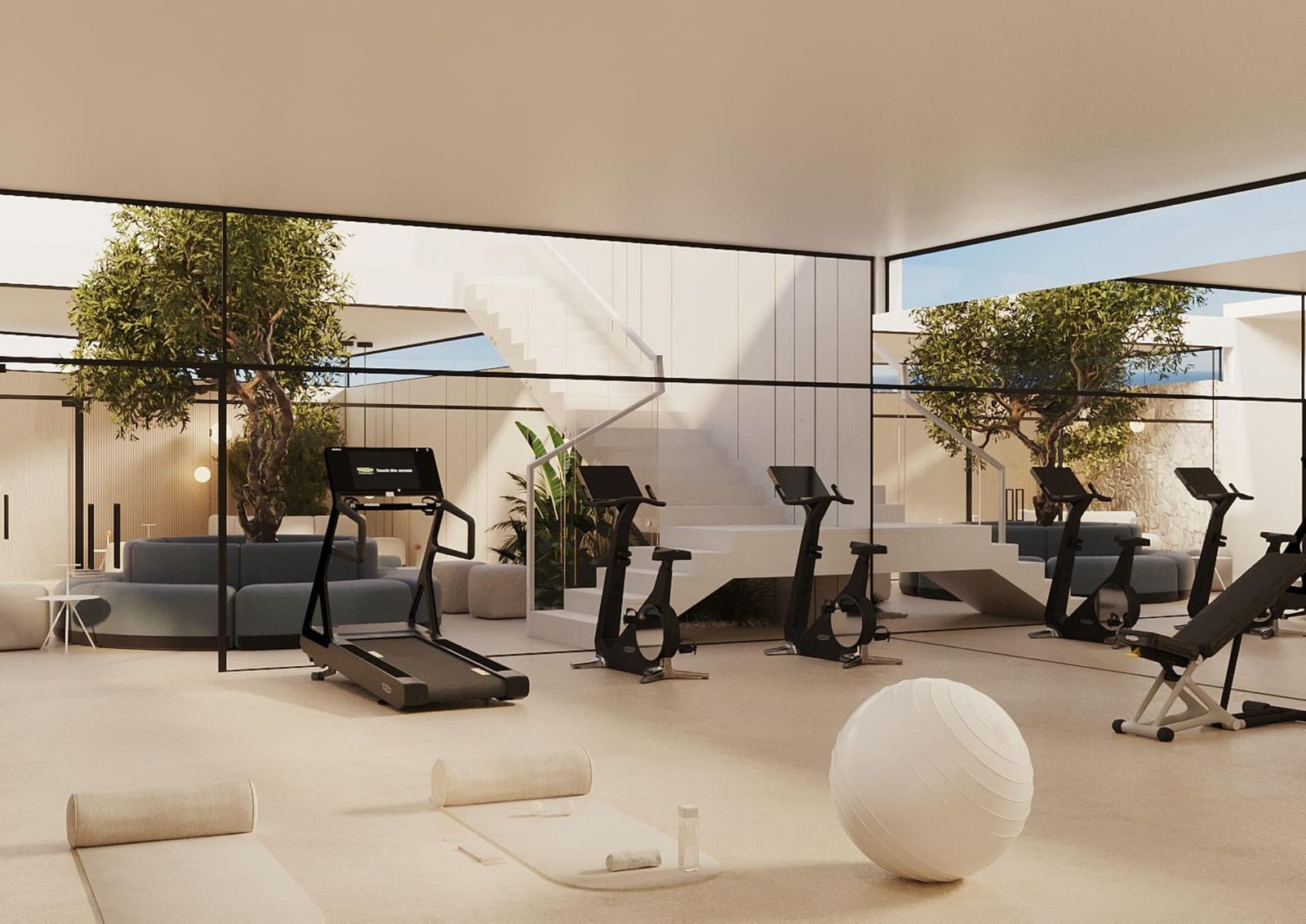 Modernes Fitnessstudio in Naya Residences mit Fitnessgeräten und Loungebereich.